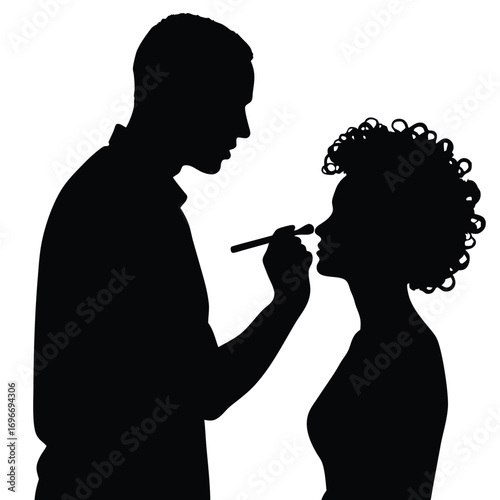 Man applying makeup to woman's nose silhouette application
