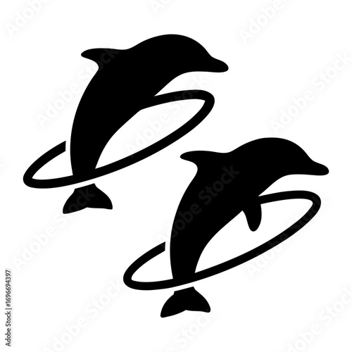Two dolphins jumping through hoops silhouette vector