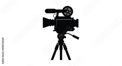 classic film camera on tripod captured in silhouette