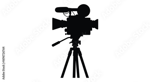 classic film camera on tripod captured in silhouette