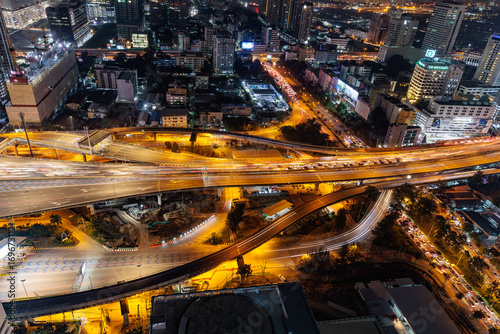 Aerial view of a traffic highway at night with long exposure in Bangkok, Thailand