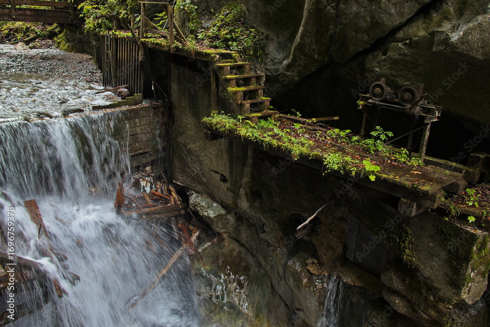 Fototapeta premium Flume at the creek Weissbach in Weissbach, Austria, Europe 