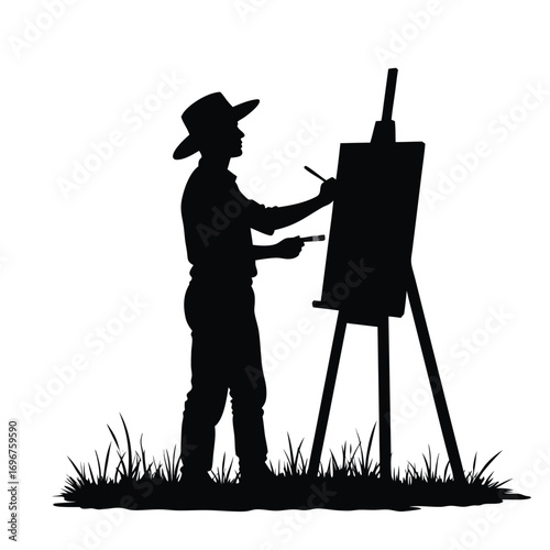 Silhouette of man painting on easel outdoors artist