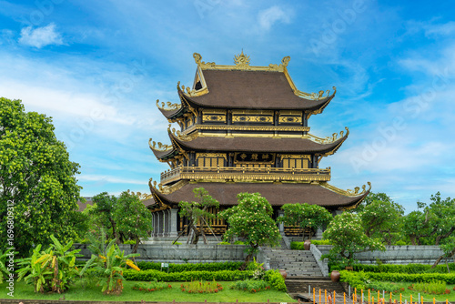 The beautiful Chua Vàng (Golden Temple) in the middle of the lake in Trang An, Ninh Binh, Vietnam