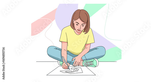 Young Woman Drawing and Creating Art While Sitting On The Floor with Paper and Pencil