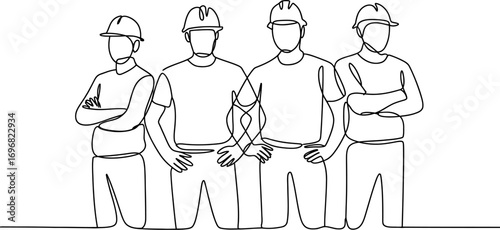 Team of construction workers standing confidently with arms crossed in a unified line
