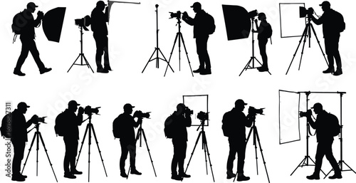 Silhouette of professional photographers working in studio, using tripods, softboxes, lighting, and camera gear during photo shoot setup