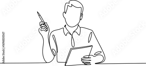 Focused person in casual shirt holding pen and tablet, contemplating an idea