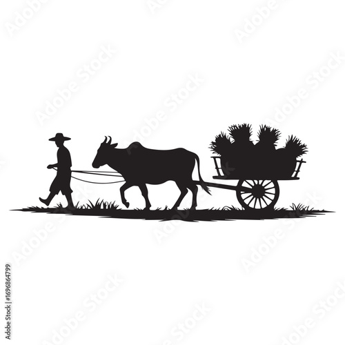 Silhouette of a farmer leading an ox pulling a cart laden with harvested crops across a field at dawn