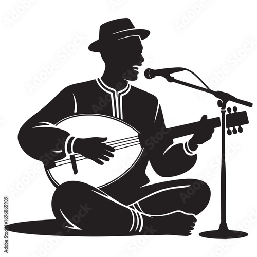 Silhouette of a man wearing a hat playing a lute and singing into a microphone while sitting on the ground
