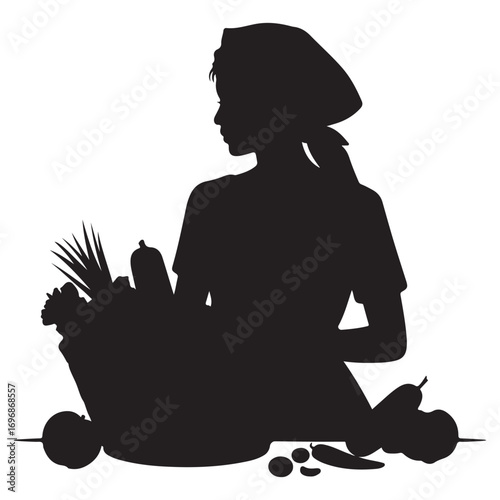 Silhouette of a woman wearing a headscarf holding a basket overflowing with fresh harvested vegetables and fruits