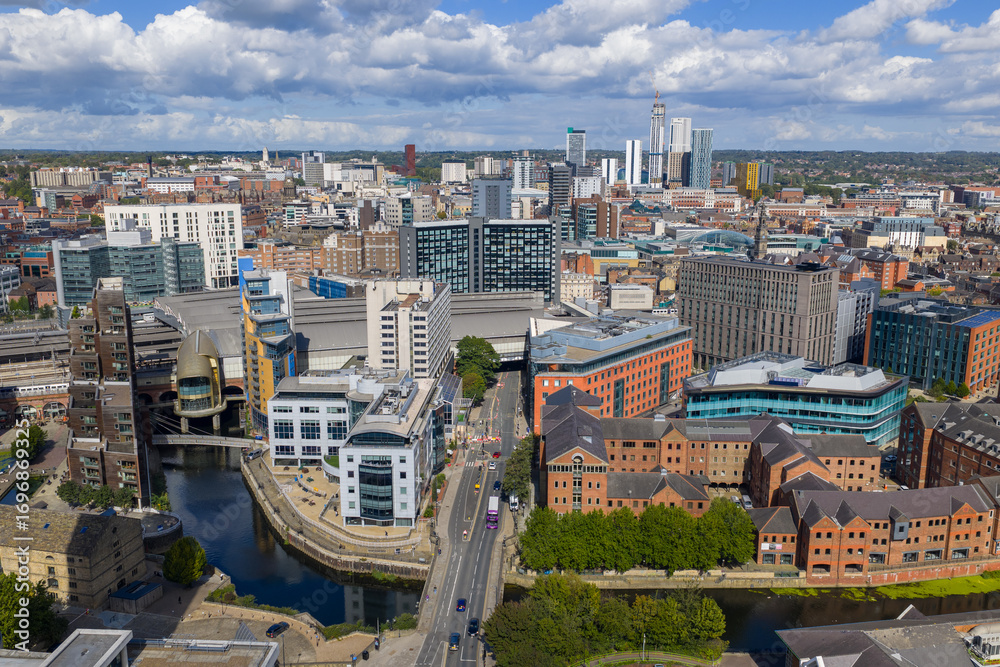 Obraz premium Aerial image of Leeds city centre, featuring River Aire, modern offices, and urban architecture in Yorkshire, England.