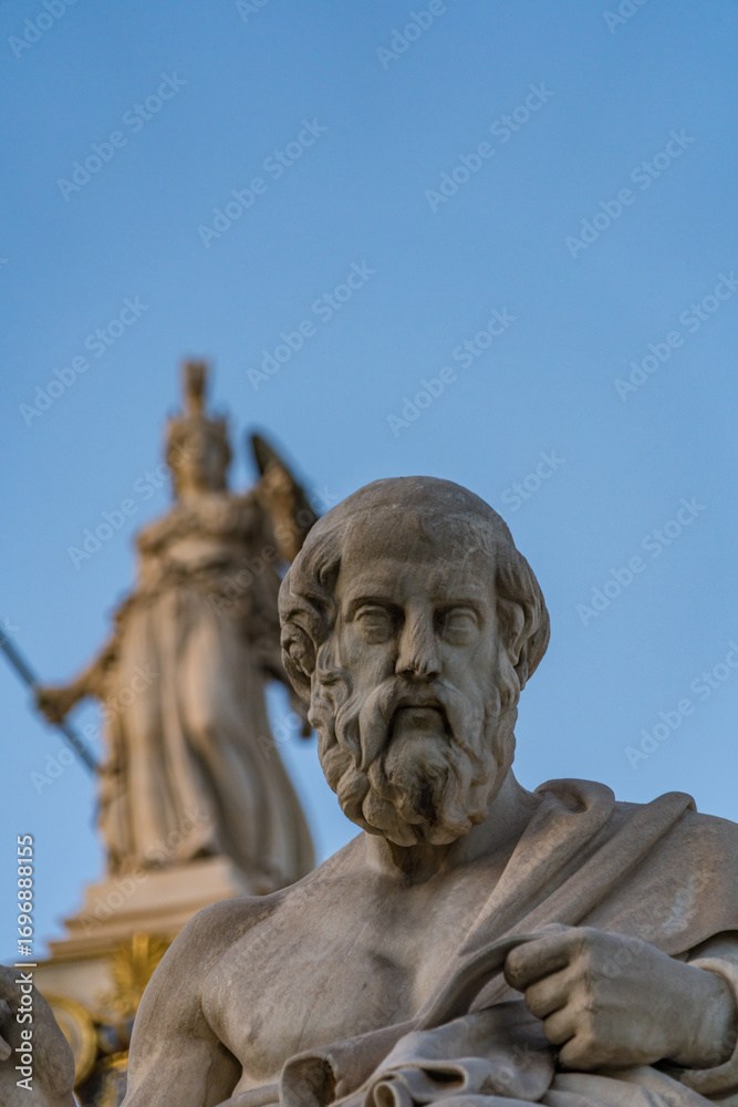 Obraz premium Marble Statue of Plato by Leonidas Drosis. Athena column in the background in front of the Academy of Athens, Greece – May 2025