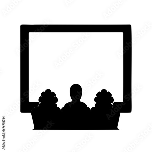 Silhouette of a movie screen with audience members in the foreground