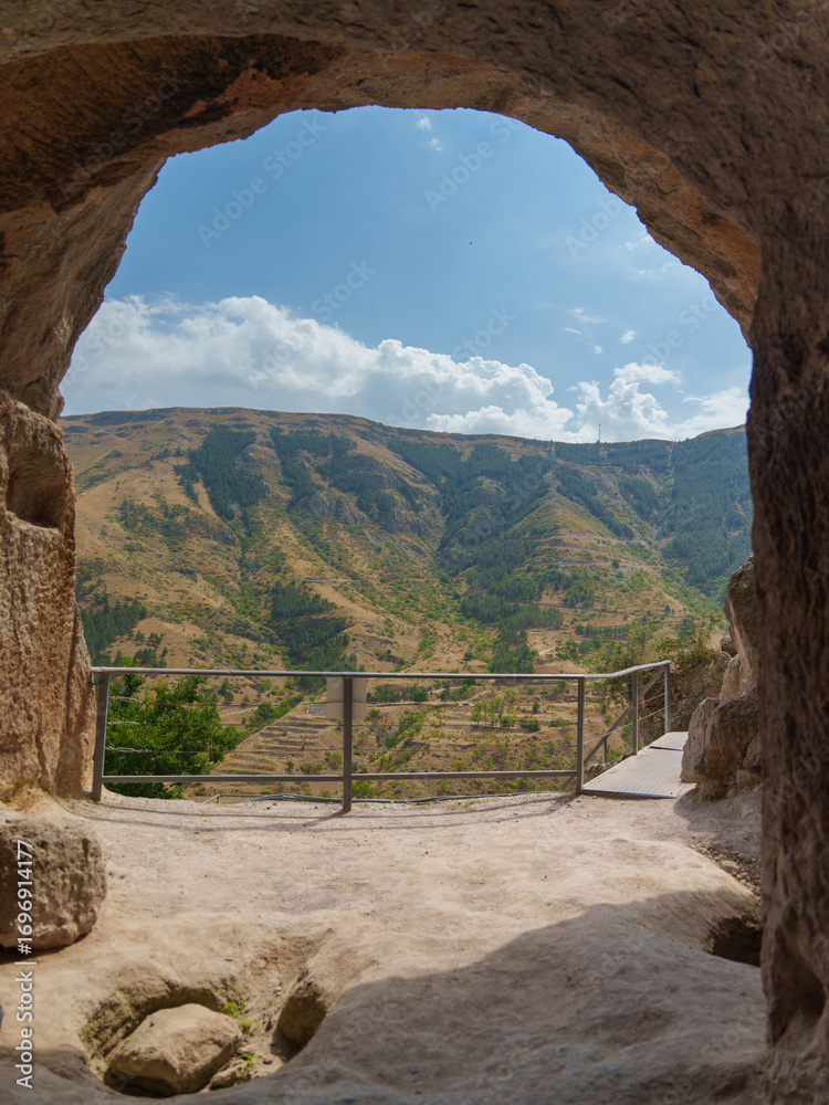 Fototapeta premium Mountain Landscape Viewed from Inside a Cave
