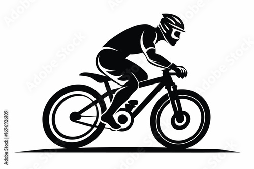 Silhouette of Cyclist Riding a Mountain Bike, Wearing Helmet and Protective Gear, Sport