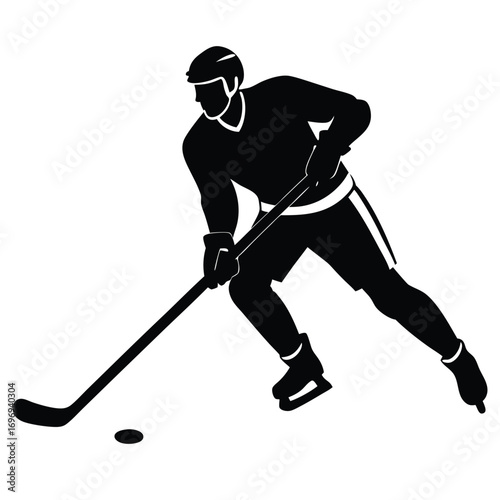 Ice hockey player dribbling puck on white background