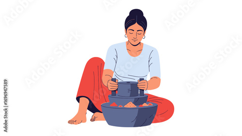 Woman Grinding Spices: A woman seated on the floor grinds spices in a traditional stone mortar, showcasing a moment of cultural tradition and culinary preparation.