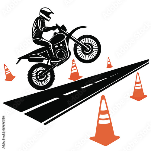 Black silhouette of motorcyclist performing wheelie on dirt bike near orange traffic cones