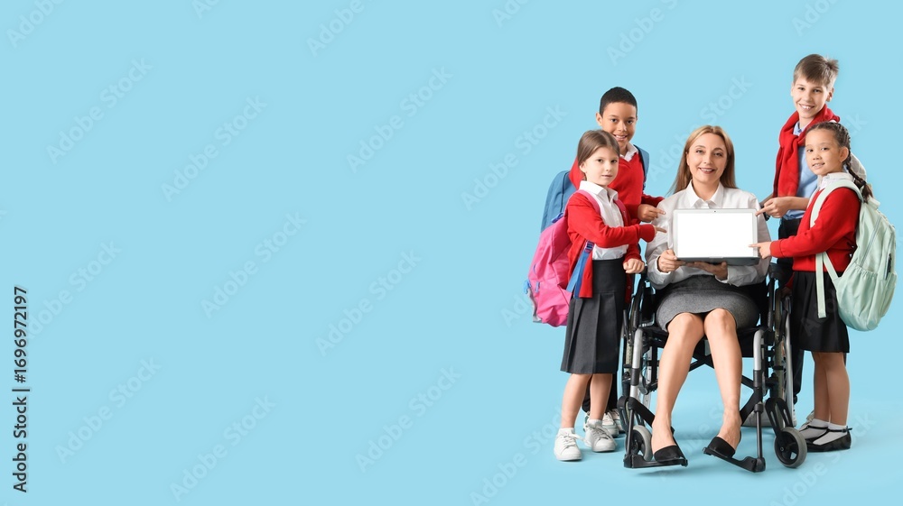 Obraz premium Mature female teacher in wheelchair and little students on blue background with space for text