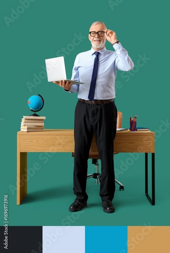 Male Geography teacher with laptop near table on green background. Different ...
