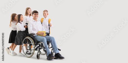 Male teacher in wheelchair ...