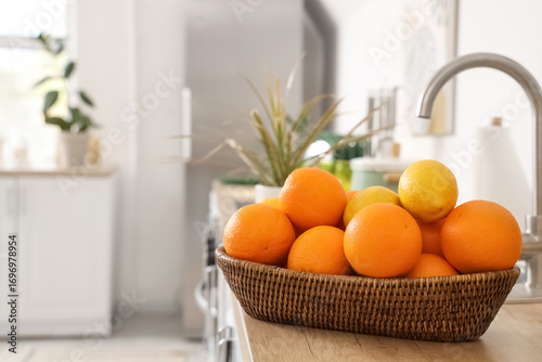 Wicker basket with lemons a...