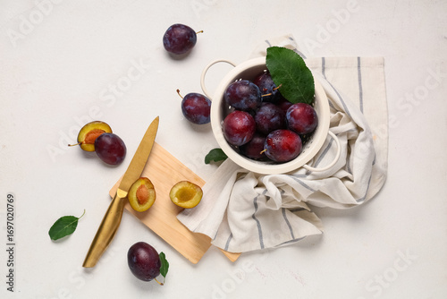 Fresh ripe plums in colande...