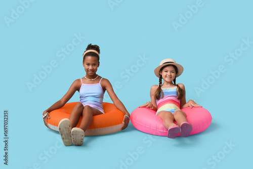 Cute little girls in swimsu...