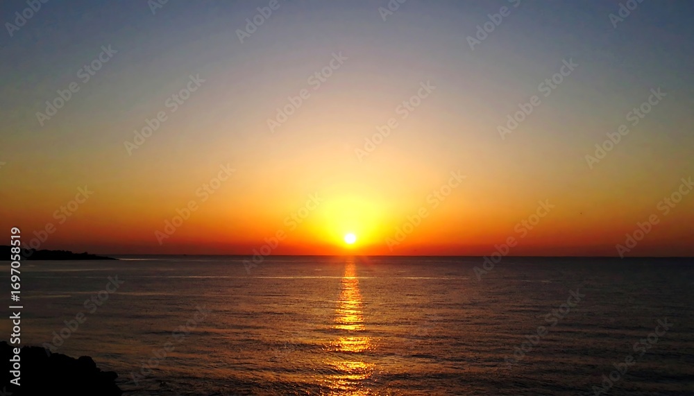 Naklejka premium Golden sunrise over the ocean, a peaceful and bright morning view