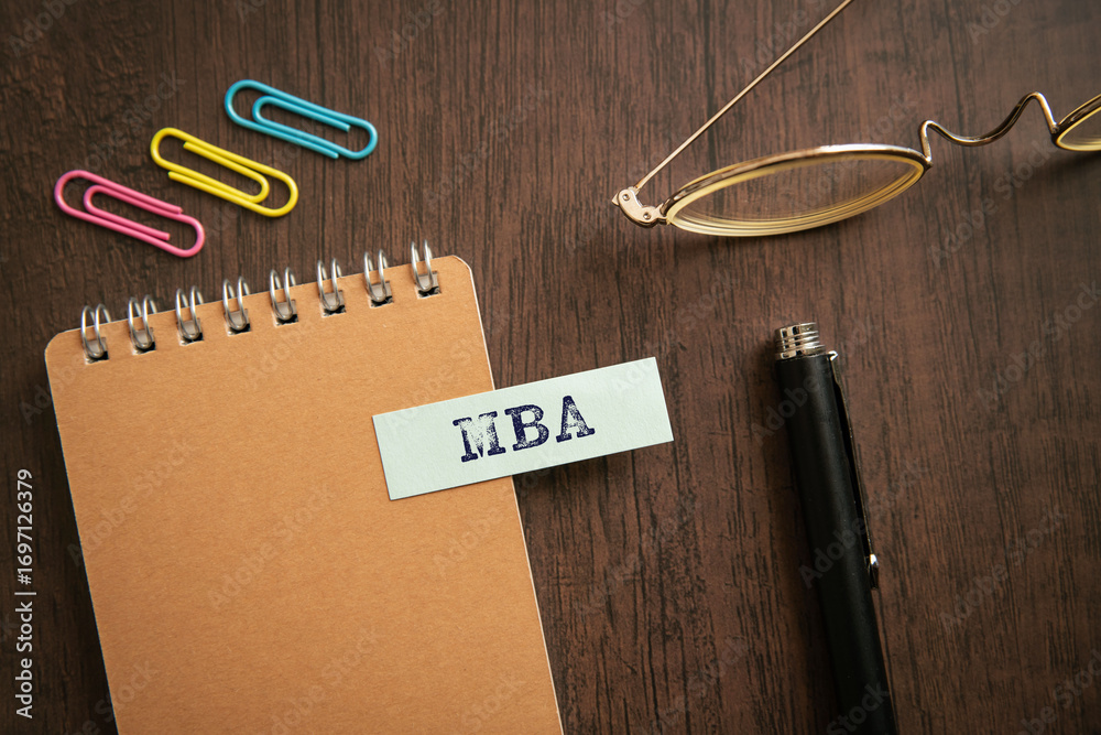 Fototapeta premium There is sticky note with the word MBA. It is an abbreviation for Master of Business Administration as eye-catching image.