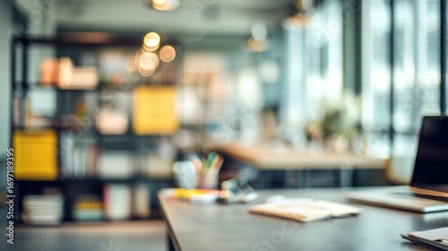 Wallpaper Mural Blurred Modern Office Workspace: Laptop, Desk, and Bookshelf Torontodigital.ca