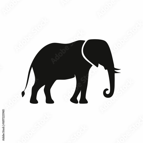 Elephant standing calmly in the african savanna, showcasing its majestic presence and strength in a simple, yet powerful silhouette.