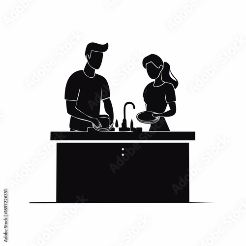 Couple washing dishes together in the kitchen