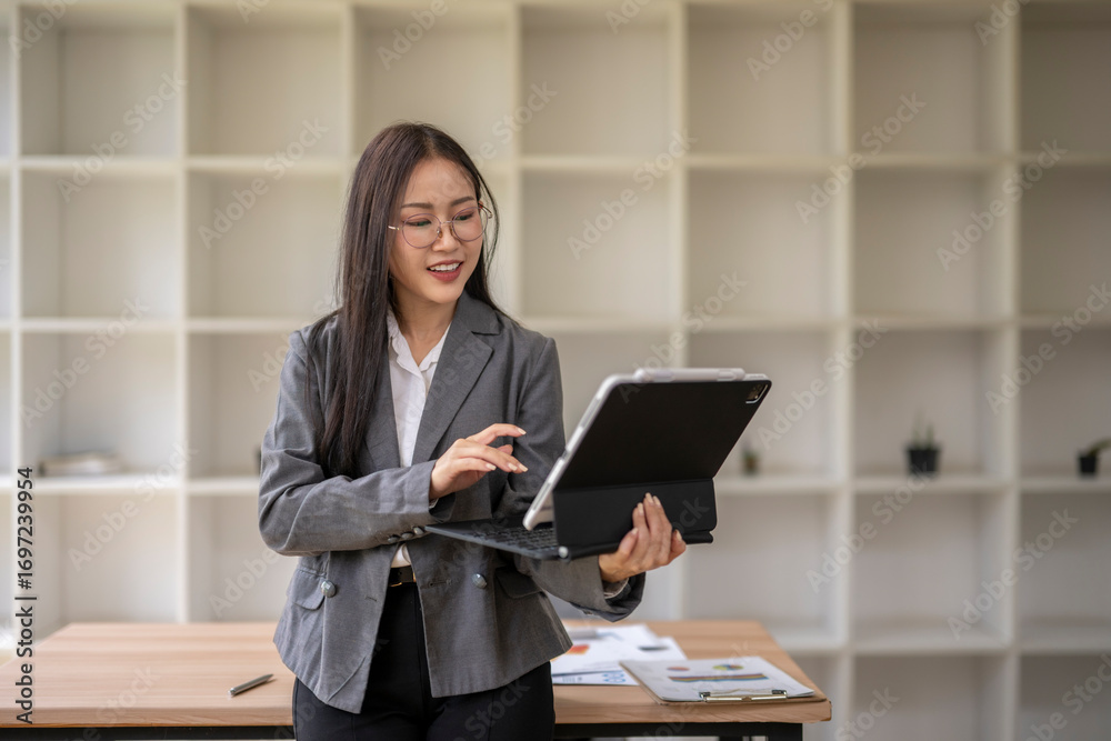 Fototapeta premium Businesswoman working with digital tablet in modern office