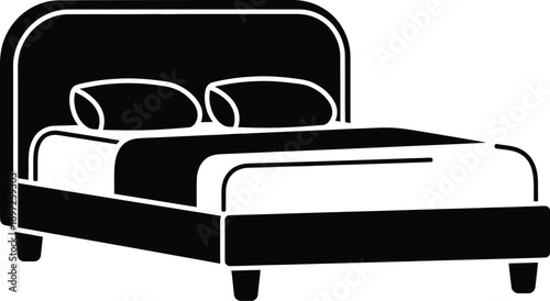 Cozy double bed with two pillows, ready for restful sleep.