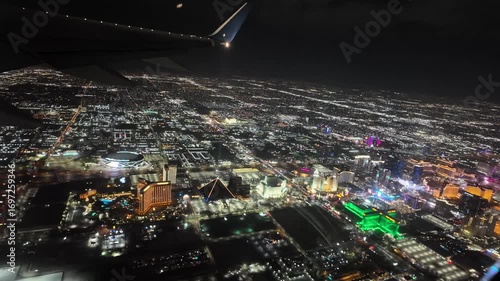 Airplane Descends Into Las Vegas at Night With Vibrant Neon Lights