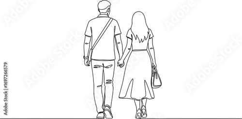 Young couple holding hands walking away from camera, symbolizing togetherness and a shared future.