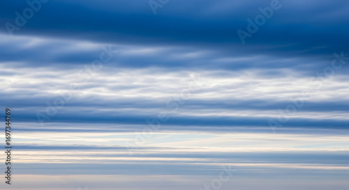 Striated cloudscape with blue and white tones