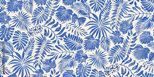 Seamless pattern of blue tropical leaves and flowers on a cream background