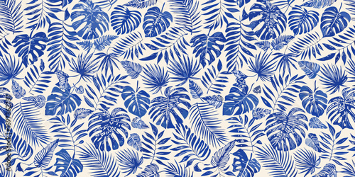 Seamless pattern of blue tropical leaves on a cream background