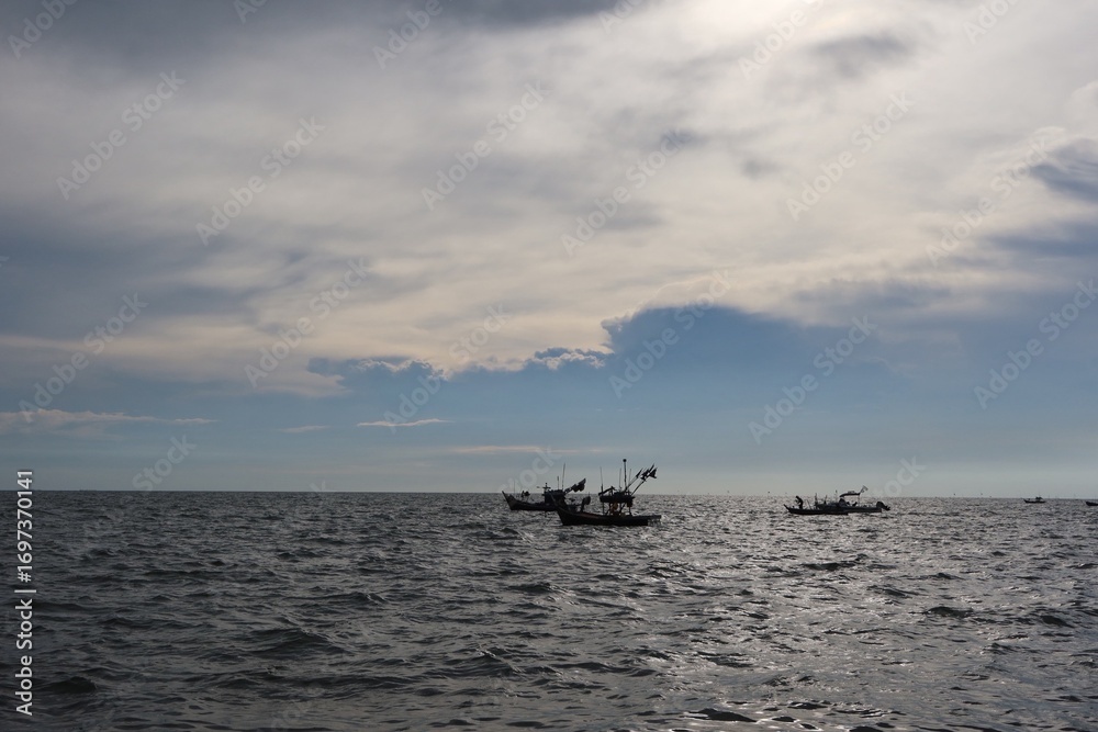 Fototapeta premium fishing boat at sunset