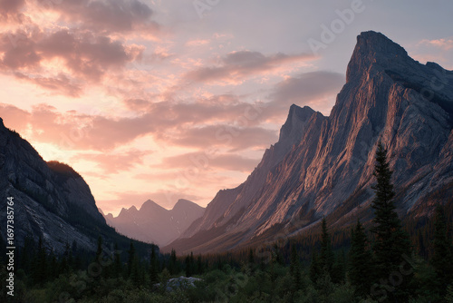 breathtaking summer sunset over alberta mountains warm hues of orange and pink as they blend into clear sky