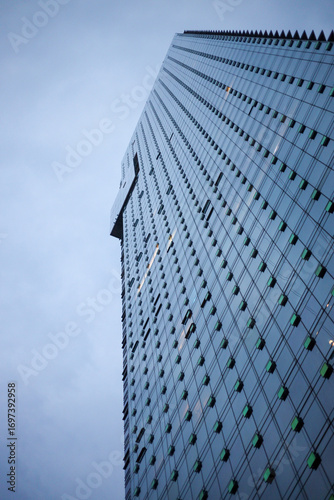 blue building in Vancouver city seen from below looking up