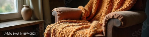 Cozy warm wool throw blanket draped over a rustic wooden armchair indoors, creating a comfortable and inviting atmosphere Perfect for autumn or winter scenes , lifestyle, winter, detail