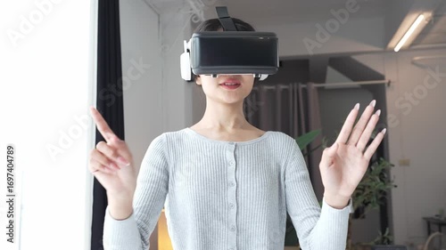 Asian Woman Playing VR Games at Home.