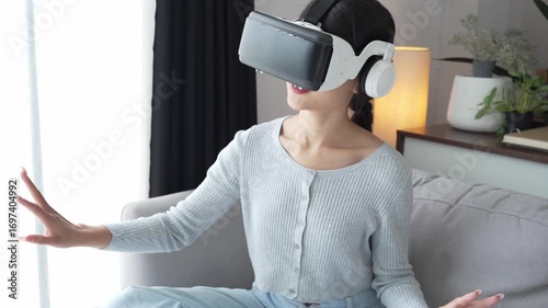 Asian Woman Playing VR Games at Home.