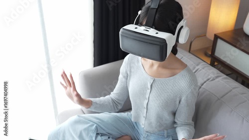 Asian Woman Playing VR Games at Home.
