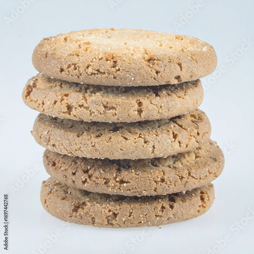 A stack of round, light brown cookies with a textured surface.