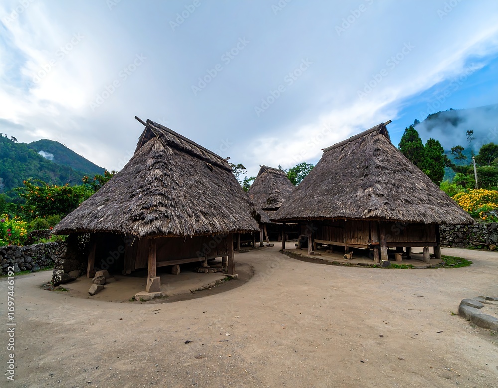 Traditional thatched-roof houses in a village setting Traditional thatched-roof houses in a village setting